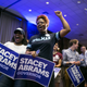 Stefanie Roberts (left) and Tonetta Collins, Spelman College friends of Georgia Democratic Gubernatorial candidate Stacey Abrams, cheer during a primary election night event on May 22, 2018, in Atlanta.